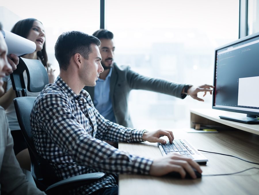 Ridge Theory software team collaborating in the office